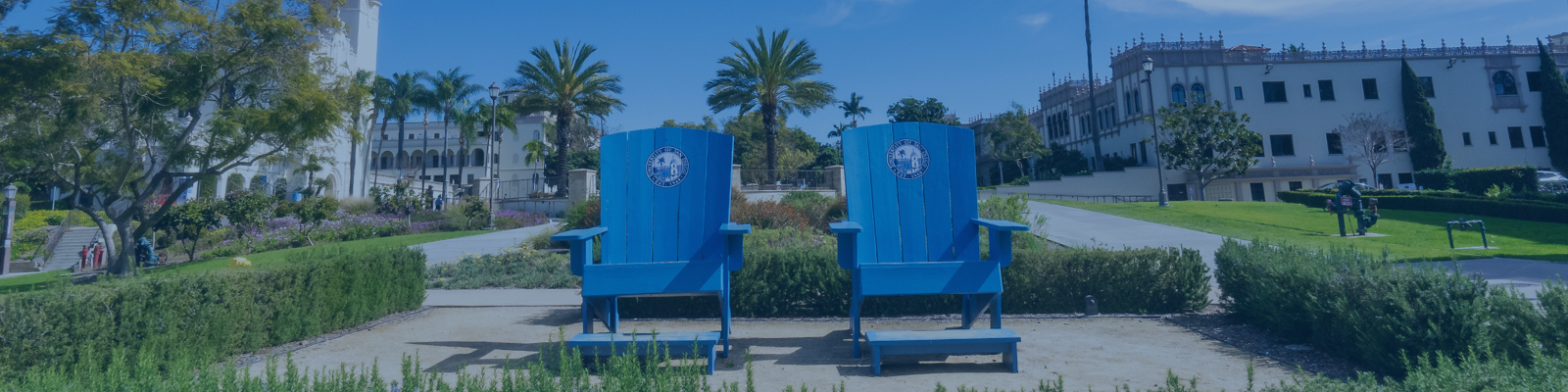 Outdoor seating area with bright blue chairs at the University of San Diego campus
